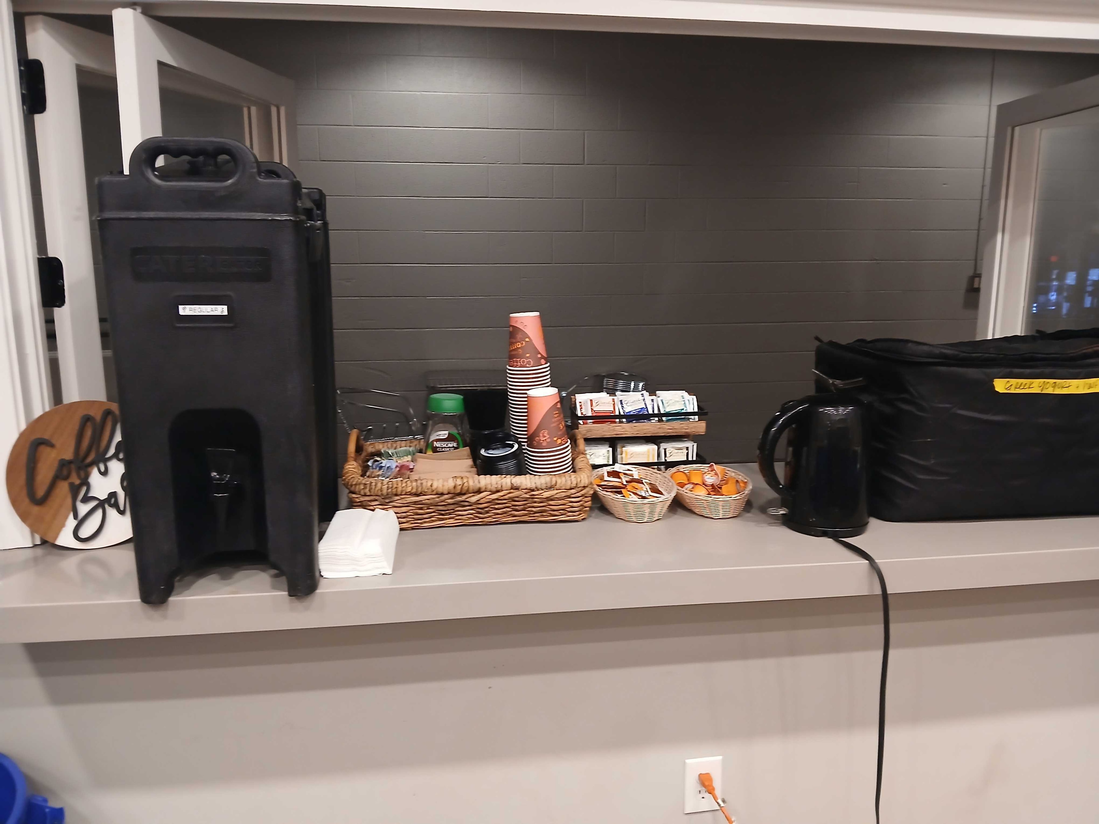 Atlanta Craft Services coffee bar with Cambro dispenser and condiment baskets