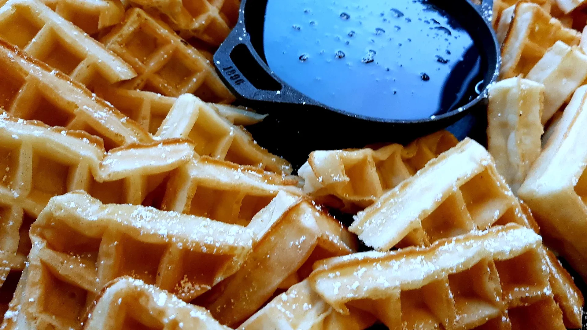 Golden waffles with cast-iron syrup dish — Atlanta production catering breakfast buffet