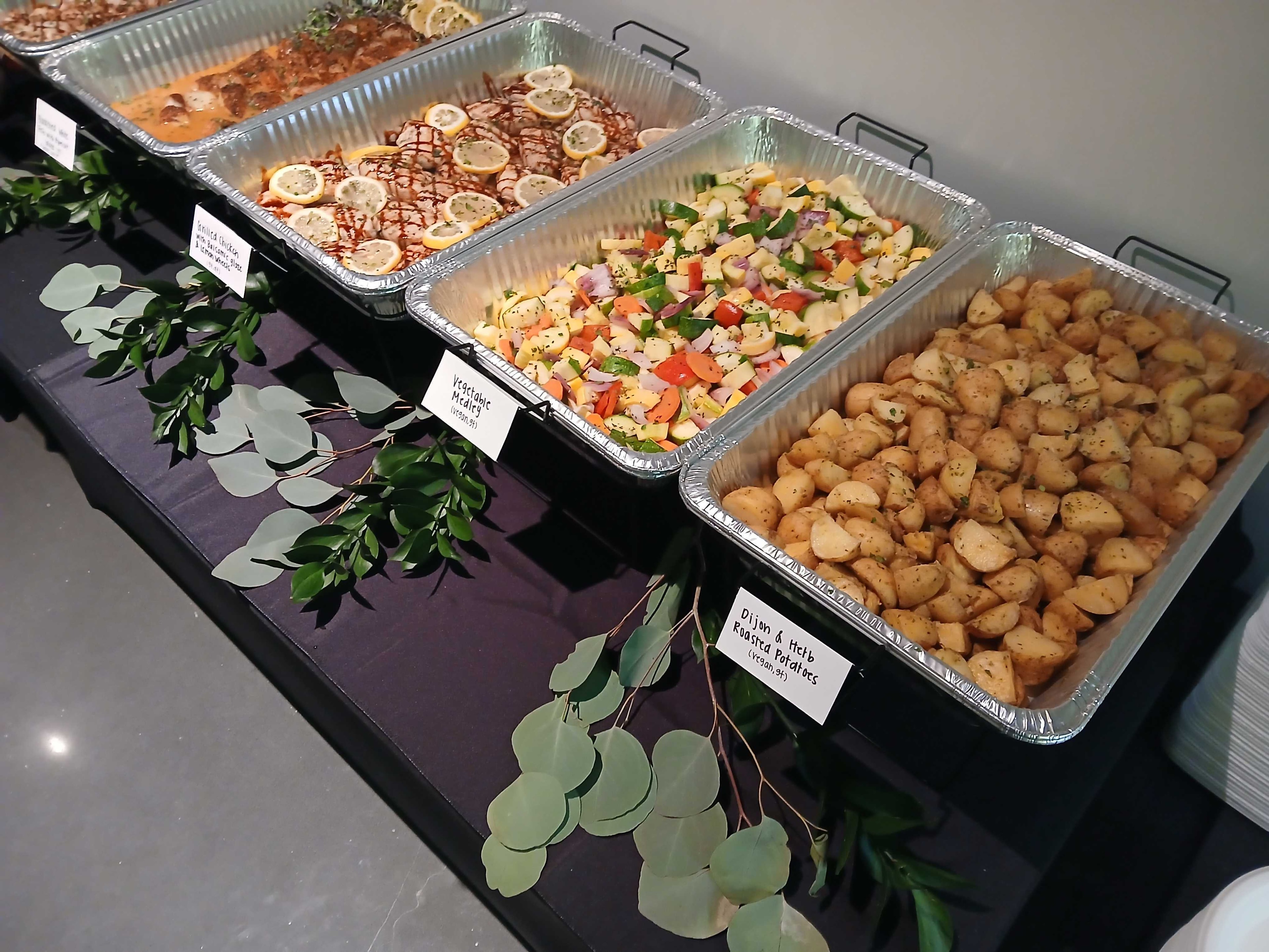 Atlanta production catering buffet with grilled chicken, vegetable medley, and Dijon herb potatoes