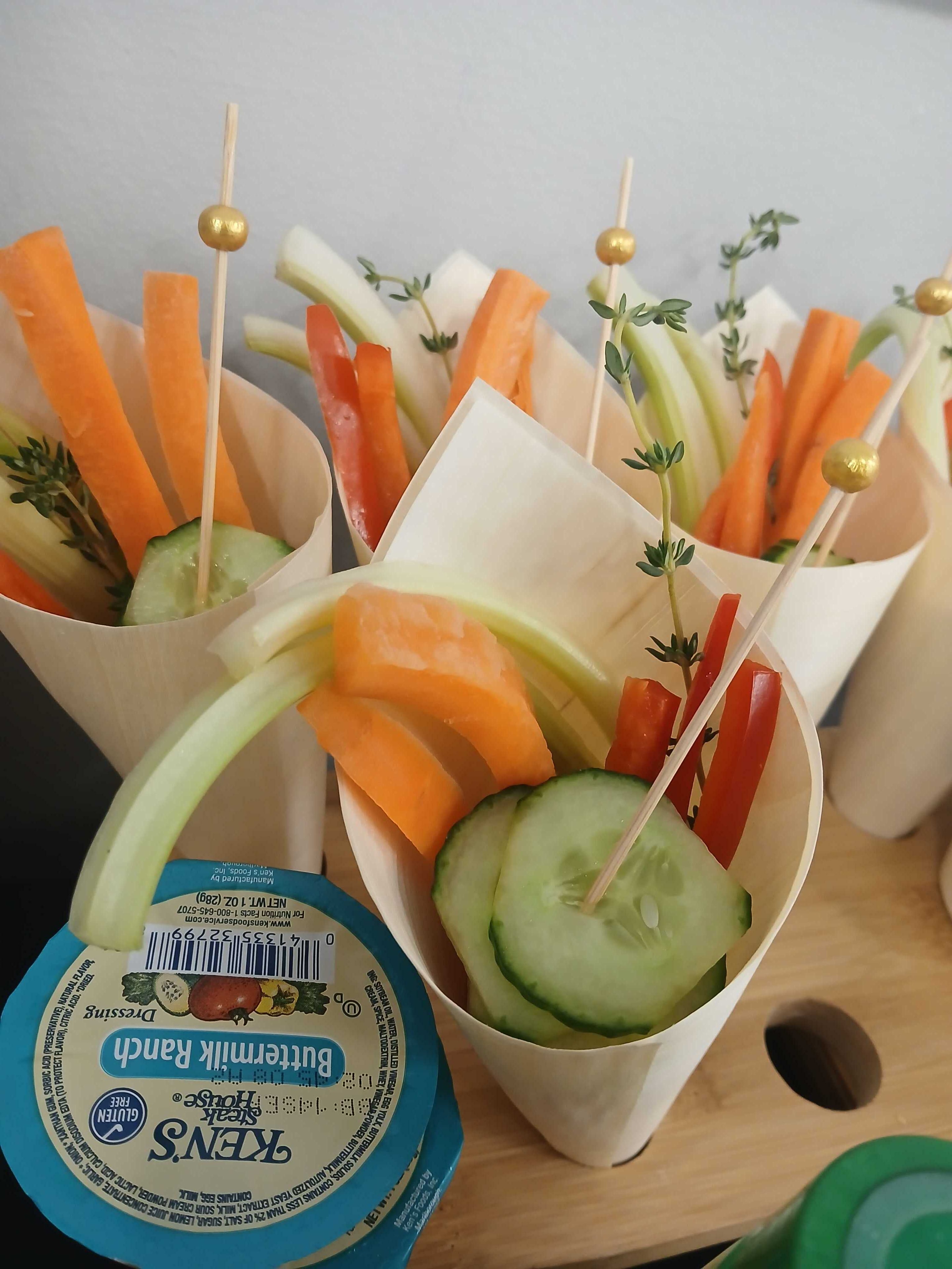 Individual veggie crudité cones with carrot, celery, red pepper, and cucumber slices with Ken's Buttermilk Ranch dressing — Atlanta craft service